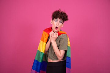 Make up. Funny drag queen posing in the studio on a pink background.