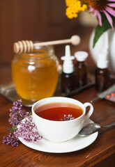 Still life from medicinal herbs, honey, herbal tea and medicines