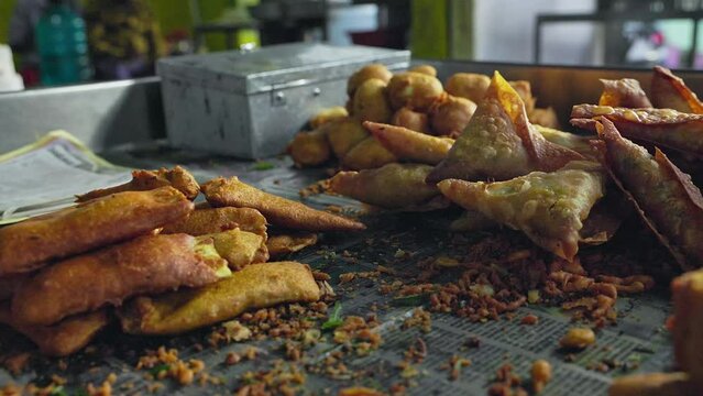A closeup of the variety of mirchi bajji, or deep-fried fritters, at the roadside shop