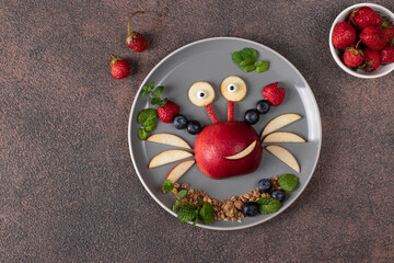 Sea crab made from fruits and berries such as apple, strawberry and blueberry - serving option for children