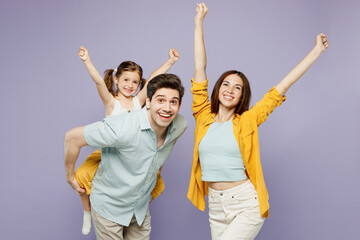 Young parents mom dad with child kid girl 6 years old wear blue yellow casual clothes give...