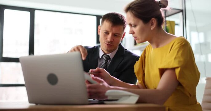 Female office manager listens to paramount wishes for project from influential developer. Employees at conference look for consensus in business plans slow motion
