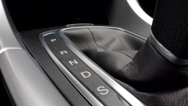 Switching the gear lever from sport mode to park mode. Shifting automatic transmission, close up