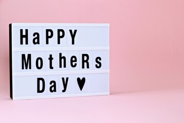 Happy Mother's Day led light box sign board on pink background.