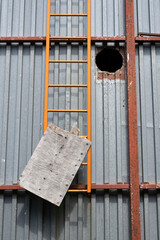 A condemned ladder in an abandoned industrial site