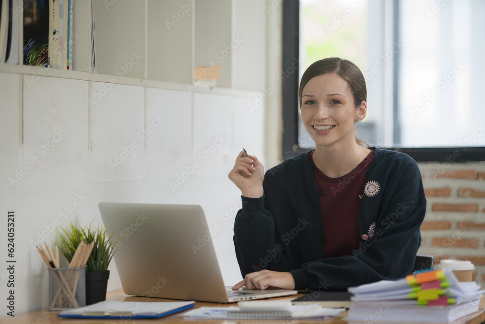 Poster a businesswoman or accountant using writing a notebook while working on an analytic business report 