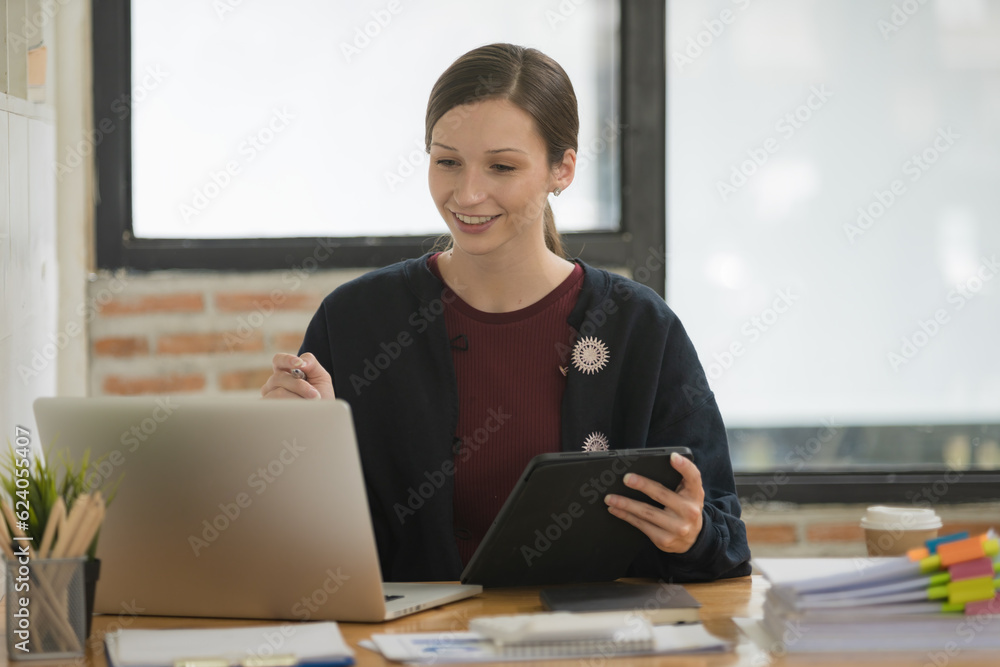 Aufkleber a businesswoman or accountant using writing a notebook while working on an analytic business report 