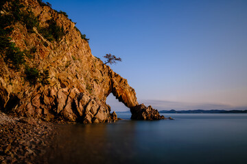 Scenic view of the rocks and sea against sky