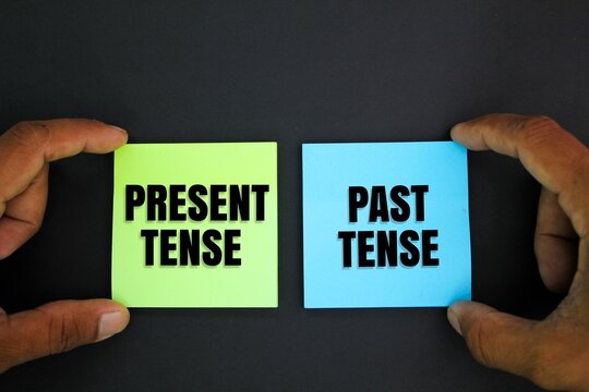 colored paper with Present Tense and Past Tense words. the concept of learning English or grammar