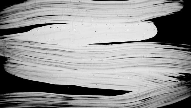 Ink Brush Stroke White in black background. Paint Brush Strokes Transition  white   on black background 