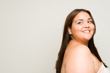 Attractive plus size woman with beautiful hair seen from behind