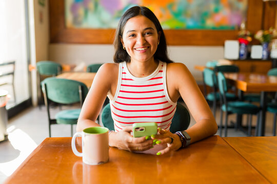 Gorgeous Hispanic Woman Enjoying Drinking Coffee