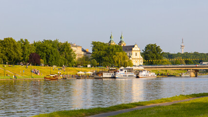 Wisła river in Krakow, Poland with the Bazylika Paulinów church in the background