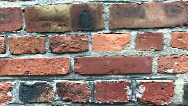 Brick wall background. Brick wall. Moving background with an old brick wall.