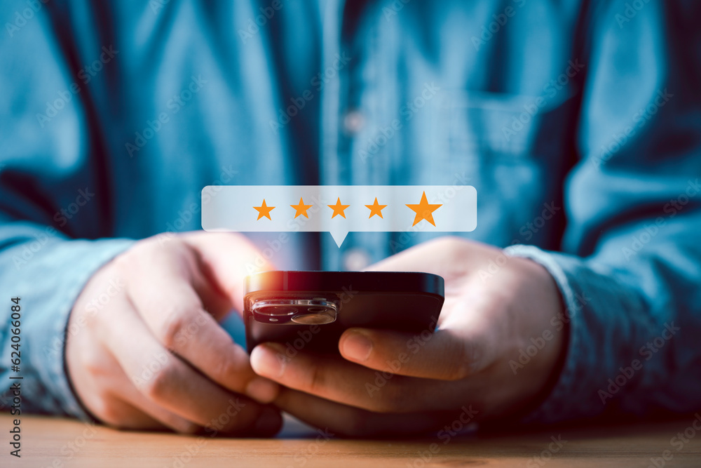 Poster Businessman using smartphone to give golden five stars for client the best satisfaction evaluation survey after use product and service concept.