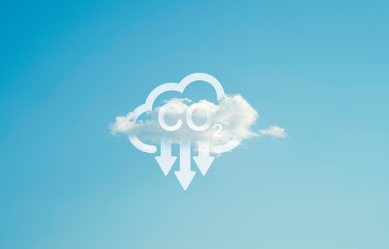 CO2 reducing icon on white cloud with blue sky for carbon footprint and carbon credit to limit global warming from climate change , Sustainable development by reduce pollution concept.