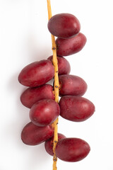 Single bouquet of red dates on isolated white background.