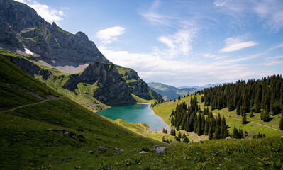 view of beautiful Bannalpsee a reservoir surrounded by mountains in the Swiss alps, Walenpfad