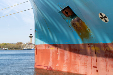 Close up view of the red and blue colored bow a ship with anchor hole, Load line mark and with...