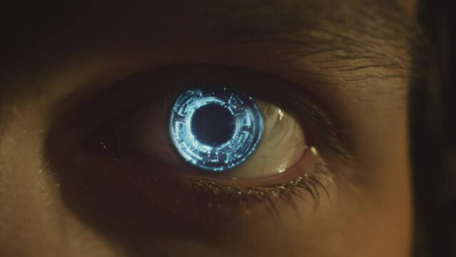Cybernetic eye close-up. Android glowing eye. Artificial intelligence concept. Sci fi, science fiction cinematic video. Eye scanner. Watcher, observer concept. Cinematic video. 