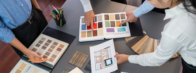 Group of professional interior designer and architect working together, planning and choosing color...