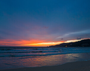 The sky changes color from yellow to red as the sun sets over the sea..sunset landscape amazing light of nature cloudscape sky. .Big sun and red lighting sky background. 4k resolution