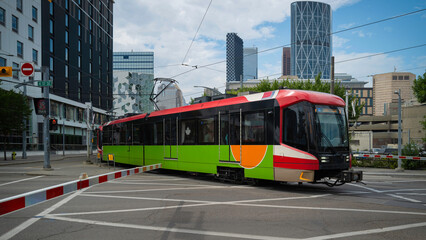 Electric bus crossing the city street in Calgary, Canada