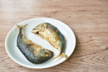 batter fried salty mackerel arranging on plate