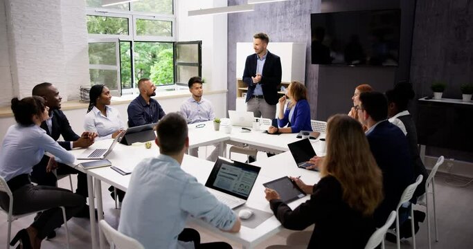Company Inside Meeting In Office Boardroom