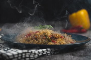 Smoky Asian salad with glass noodles, chicken, prawn, shrimp and vegetables