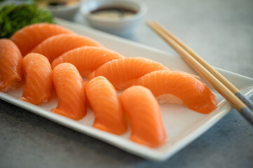 Fresh Sushi Roll with salmon.Japanese food. Copyspace black background.