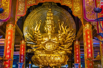 Fototapeta premium Bai Dinh Buddhist temple in Ning Binh Vietnam filled with architectural marvels of statues icons and magnificent Buddha buildings with classic ancient design 