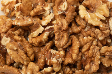 Baked walnuts skin texture. Food background.