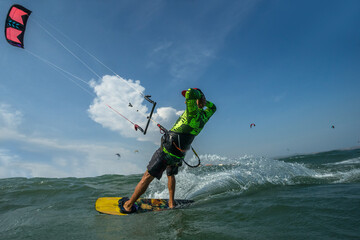 A kite surfer rides the waves