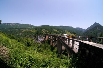 Fototapeta na wymiar Beautiful View of Djurdjevica bridge over the river Tara in Montenegro, during summer