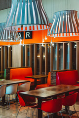 Modern restaurant interior with bright red and green design