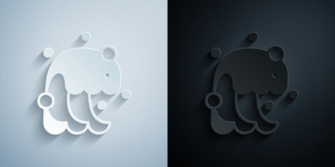 Paper cut Tsunami icon isolated on grey and black background. Flood disaster. Stormy weather by seaside, ocean or sea wave or tsunami. Paper art style. Vector