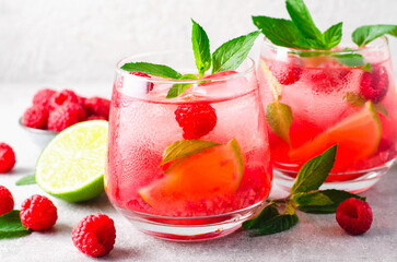 Refreshing Cold Cocktail or Mocktail with Berries and Lime, Raspberry Lemonade