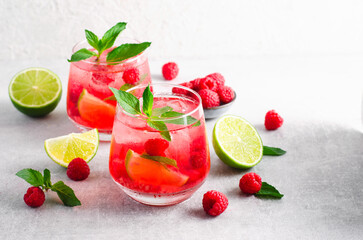 Refreshing Cold Cocktail or Mocktail with Berries and Lime, Raspberry Lemonade