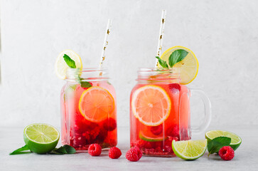 Refreshing Cold Cocktail or Mocktail with Berries and Lime, Raspberry Lemonade