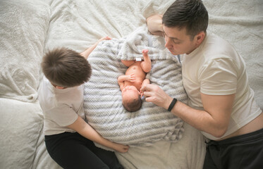 Portrait of father and his four son holding his newborn baby