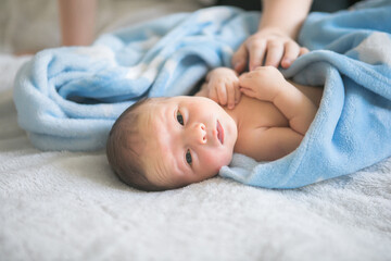 happy little kid boy with his newborn baby brother