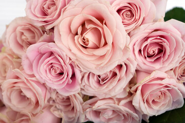 Beautiful fresh pink roses in the flower shop. Bouquet of roses.