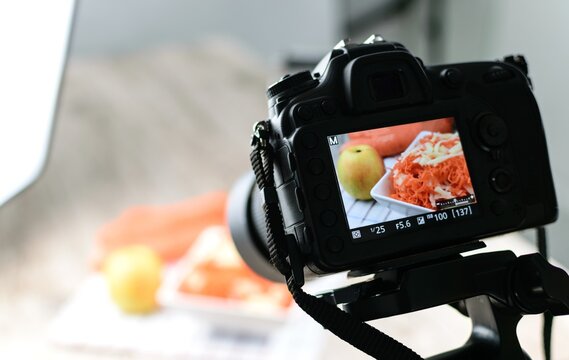rear view of DSLR camera making a food photography in the photo studio
