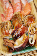 Seasoned grilled seafood at traditional market