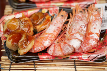 Seasoned grilled seafood at traditional market