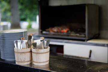 on a counter are containers with cutlery