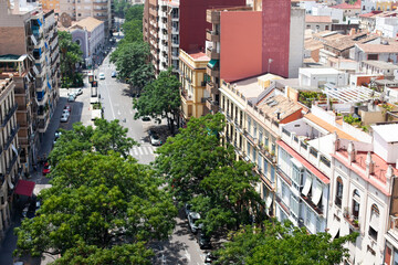Aerial view of road with trees in Valencia, Spain. Green capital of Europe. Cityscape of modern city.