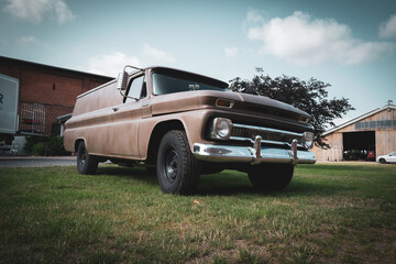 an old Chevrolet oldtimer stands on a yard