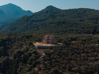 Fototapeta na wymiar House on a hill in Corfu, Greece